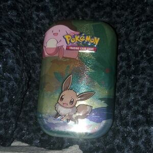 Pokemon Tin with 70 Cards